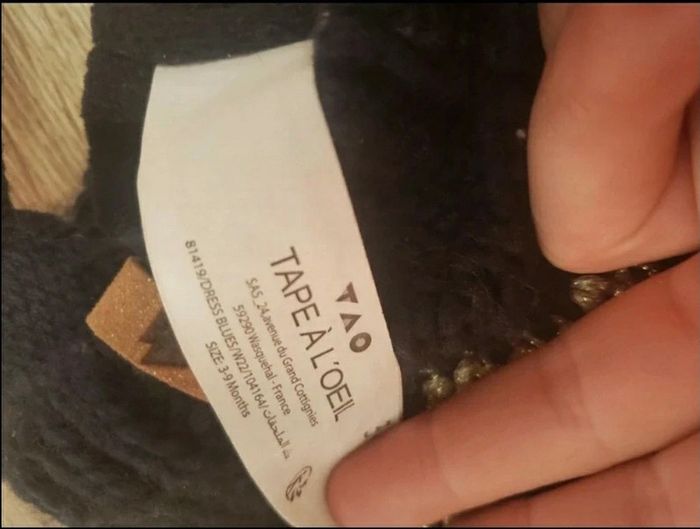 Bonnet en laine avec pompon liserai d'aspect doré - photo numéro 2