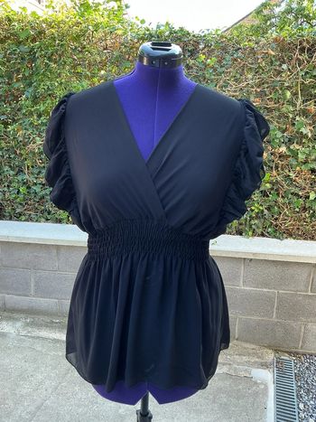 Top péplum noir