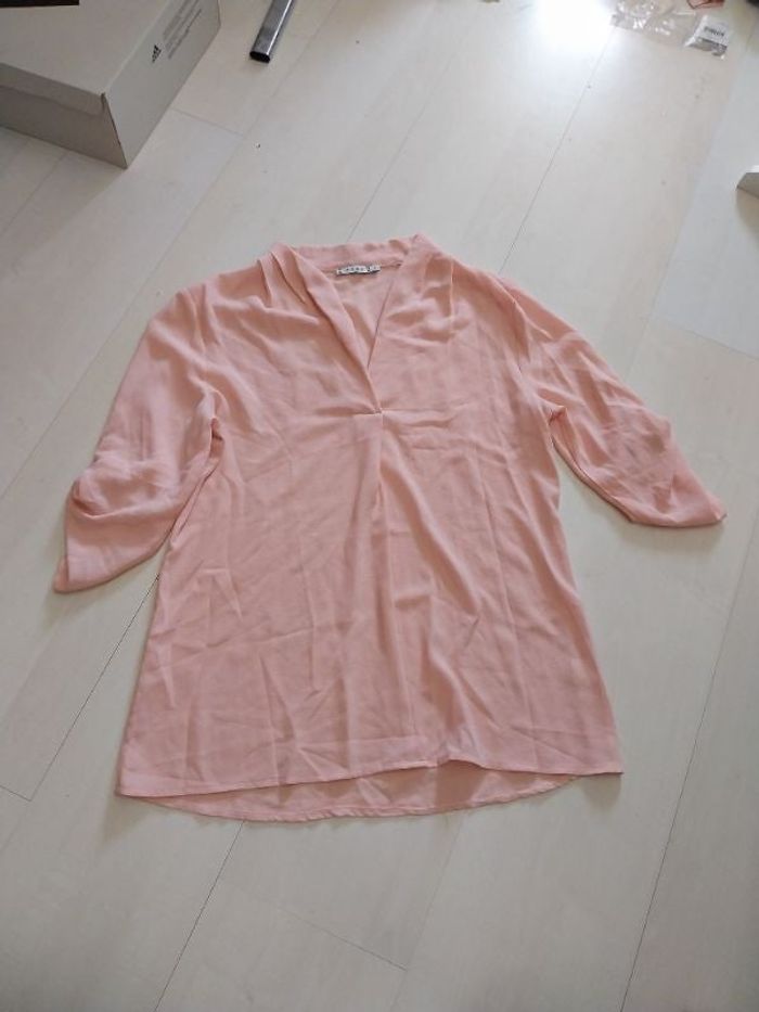 Chemisier rose pâle