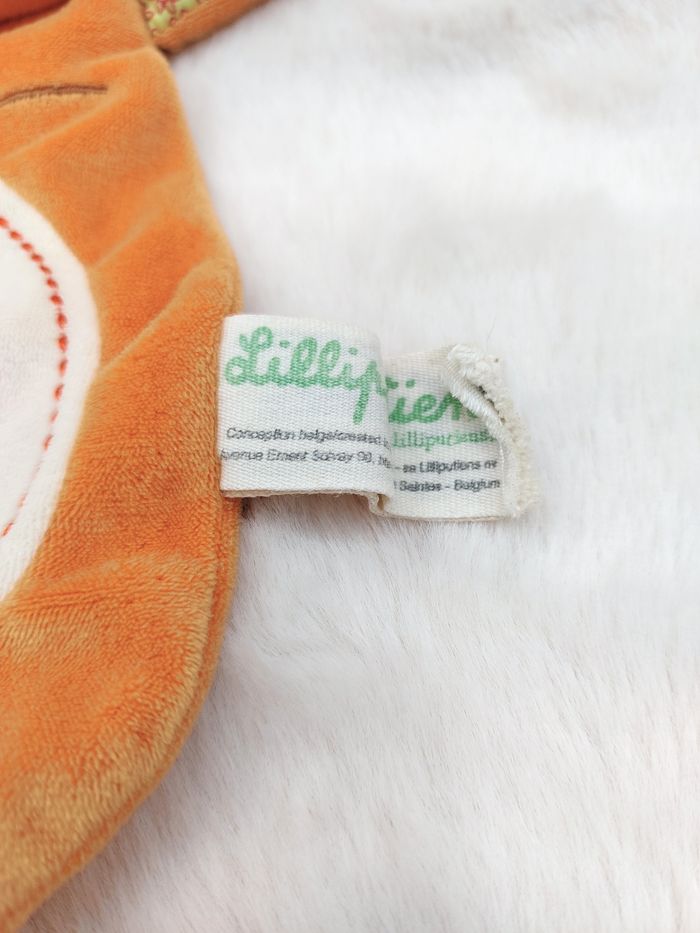 Doudou plat marionnette tigre orange Tom Les Lilliputiens rond écru fleurs rayé - photo numéro 2