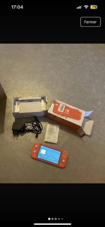 Nintendo switch lite rose encore sous garentie 2 ans
