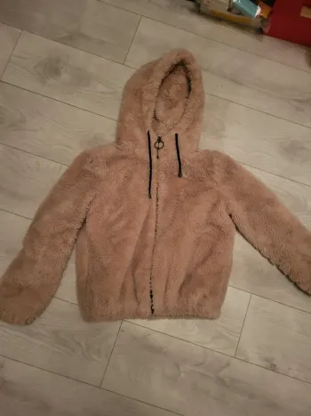 Manteau rose pâle