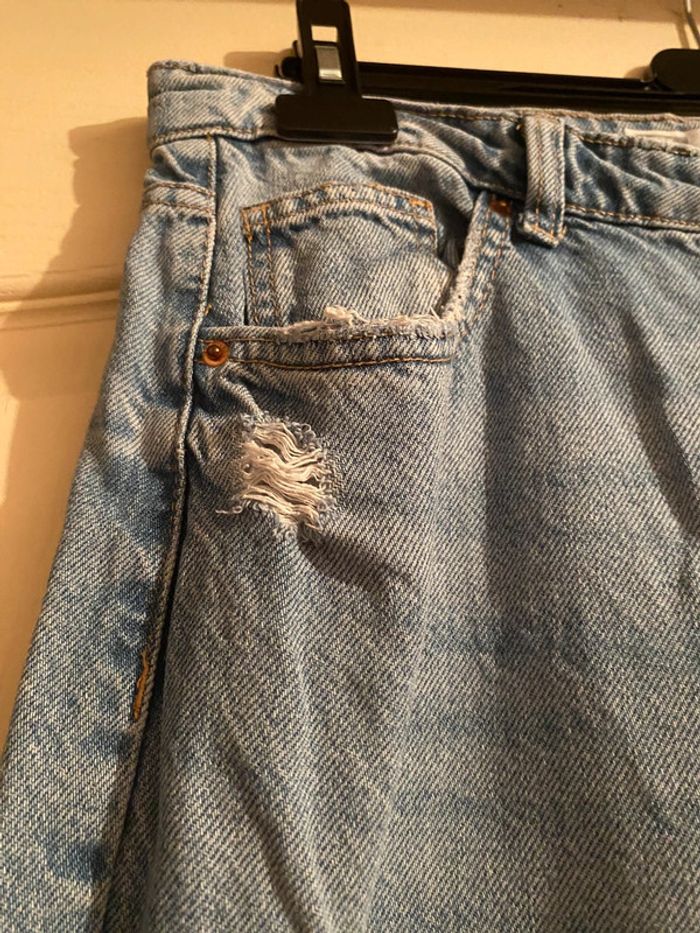 Jeans troué - photo numéro 5