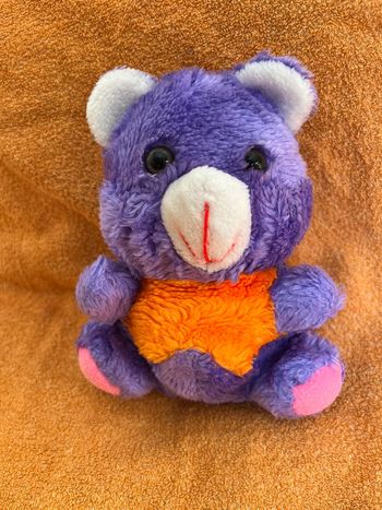 Peluche ours violet et orange