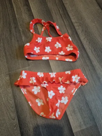 Maillot de bain / de piscine 2 pièces orange corail à pâquerettes. Fille. Taille 8 ans. Nabaiji. TBE