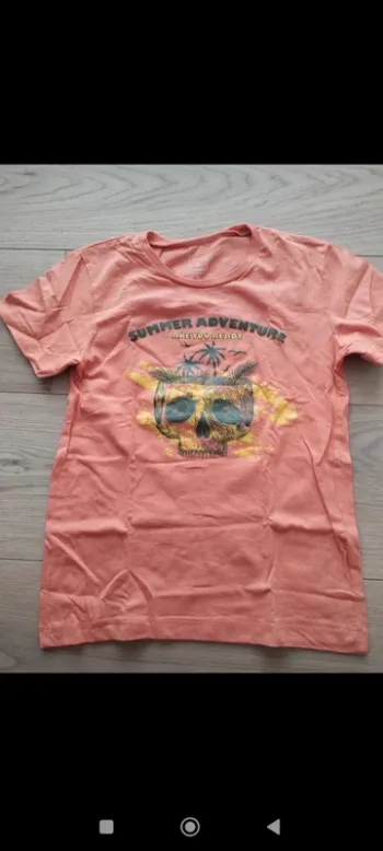 Tee shirt à motifs orange firefly 8 ans neuf sans étiquette
