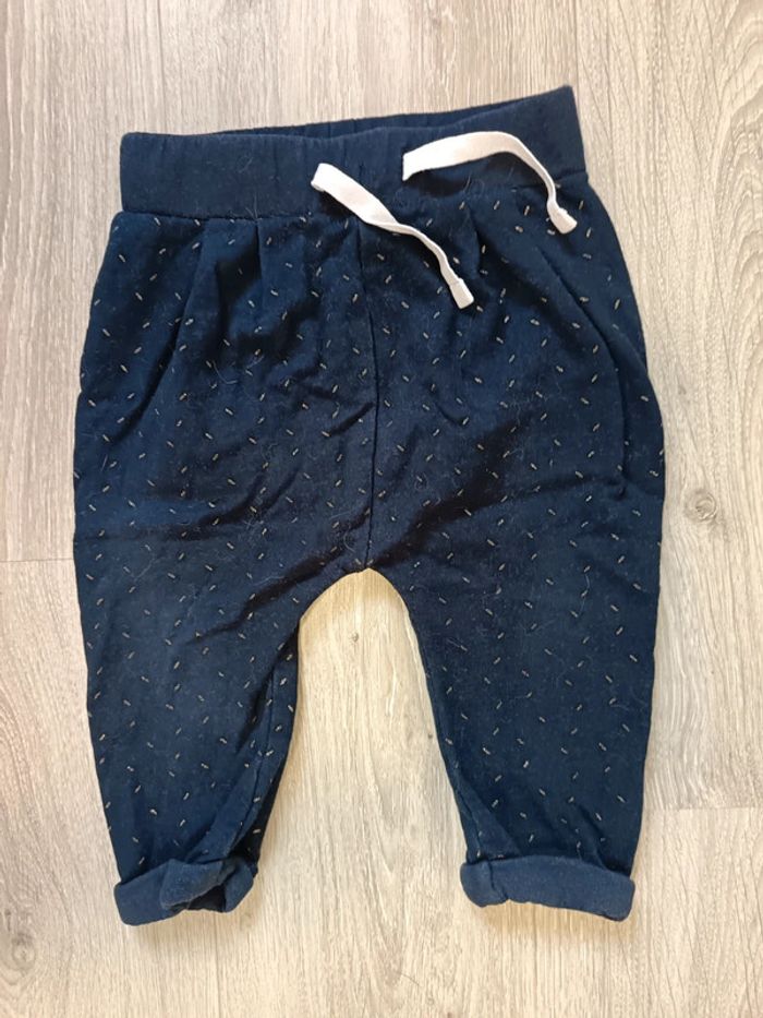 Pantalon bleu marine motifs dorés fille 12 mois