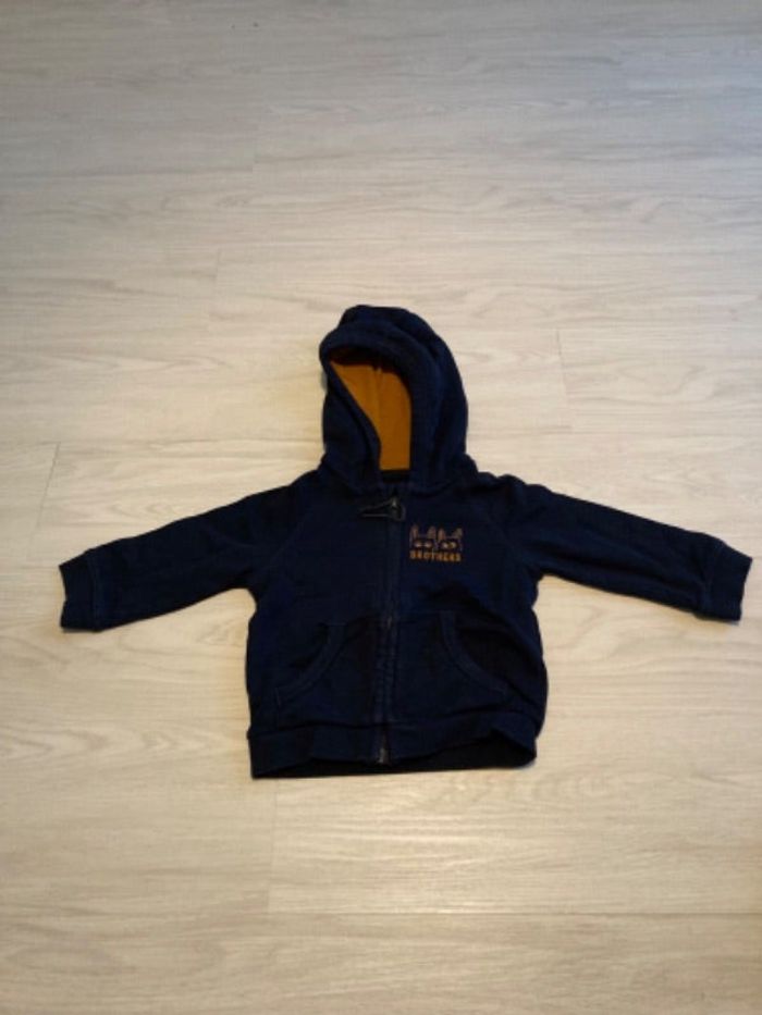 Gilet zip à capuche