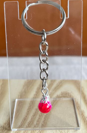 Porte clé perle fuschia