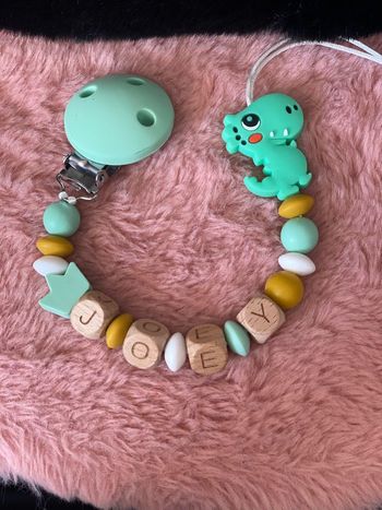 Attache tétine dinosaure