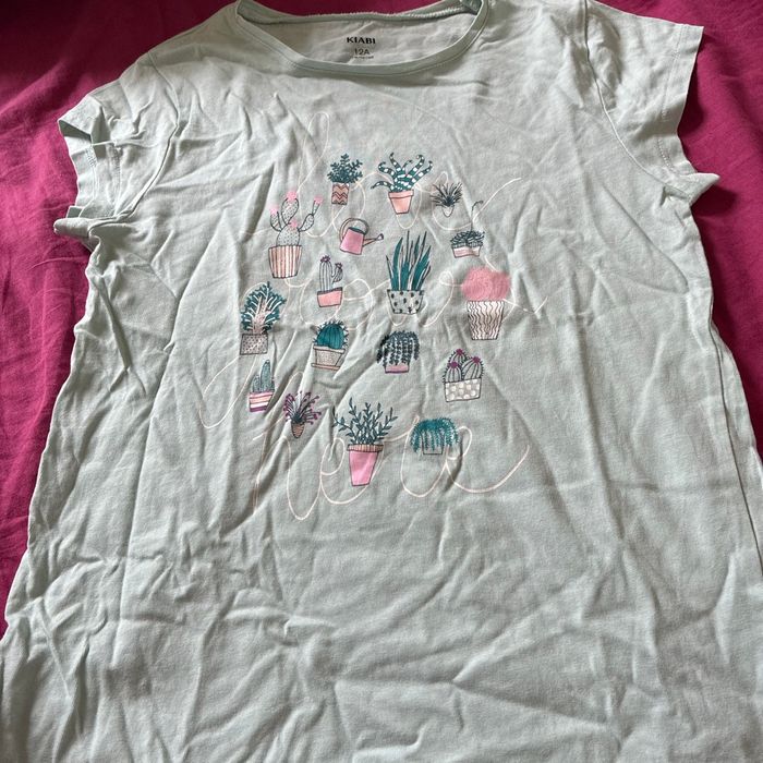 T shirt vert pale 12 ans - 1,50€