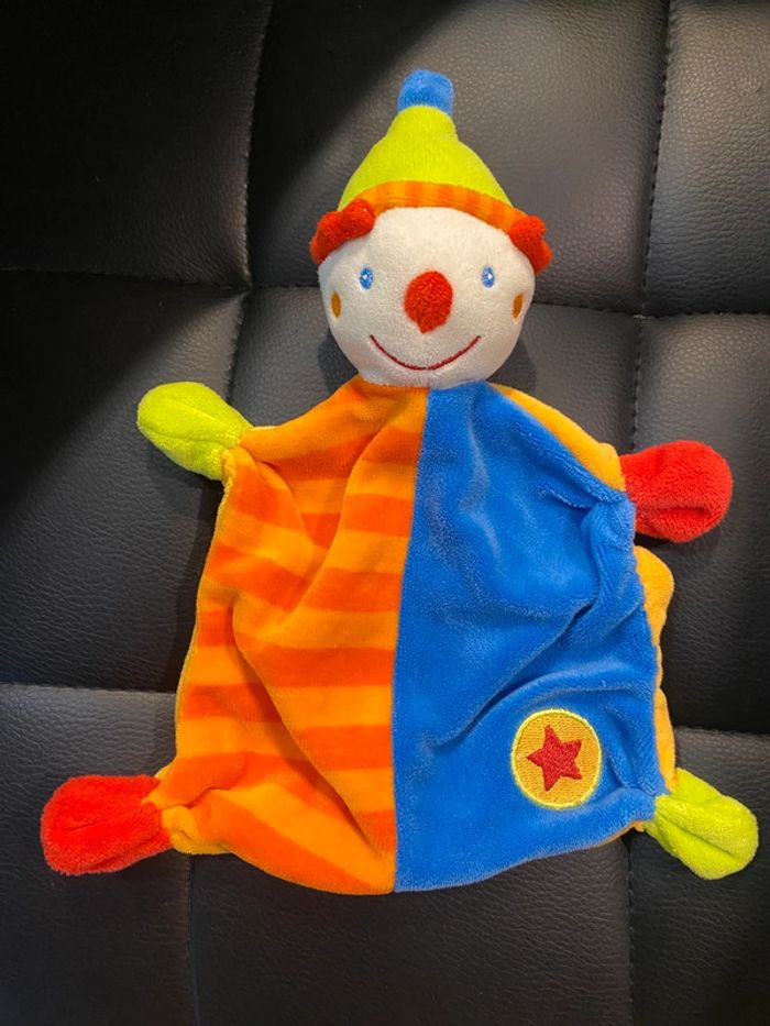 doudou plat clown bleu orange rouge vert étoile Baby Club C&A