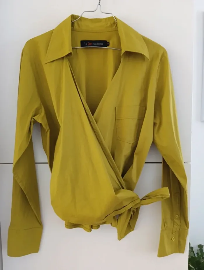 Blouse cache coeur vert olive
La fée maraboutée
Taille 40 - photo numéro 7