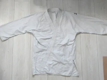 Haut de kimono judo veste arts martiaux Outshock taille 150