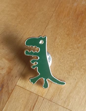 Pin's dinausore vert neuf