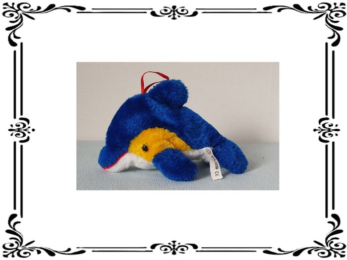 Peluche dauphin bleu.