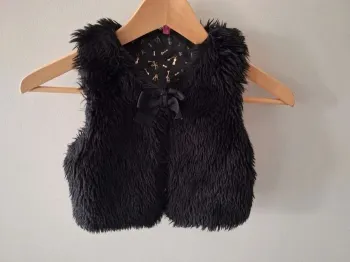 Veste sans manche noire fausse fourrure fille Gémo 4 ans