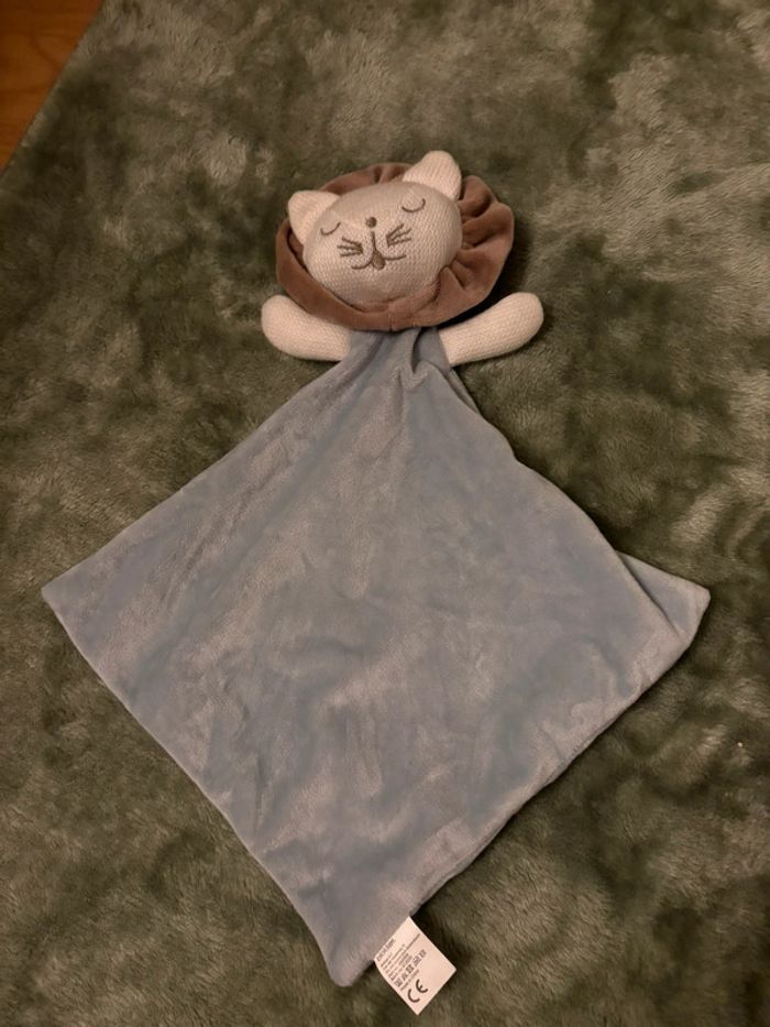 Doudou plat lion