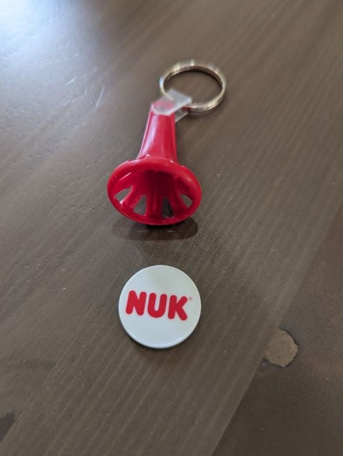 1 porte-clés jeton de caddie / chariot de courses. Marque NUK. NEUF