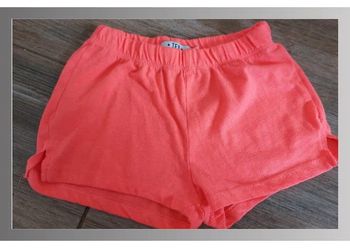 Short fille orange 5/6 ans tex