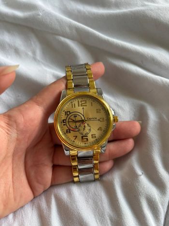 Montre homme Capricie – neuve – cadran doré – bracelet argenté/doré acier inoxydable