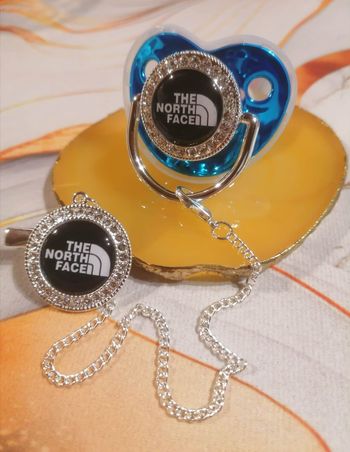 Tétine the North face bleu