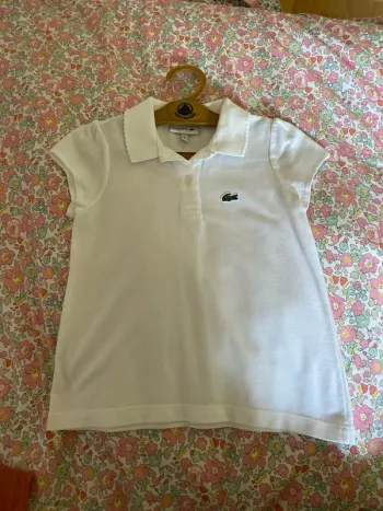 Magnifique polo neuf Lacoste 5 ans blanc