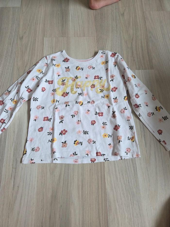 Polo manches longues fleurs taille 5 ans primark