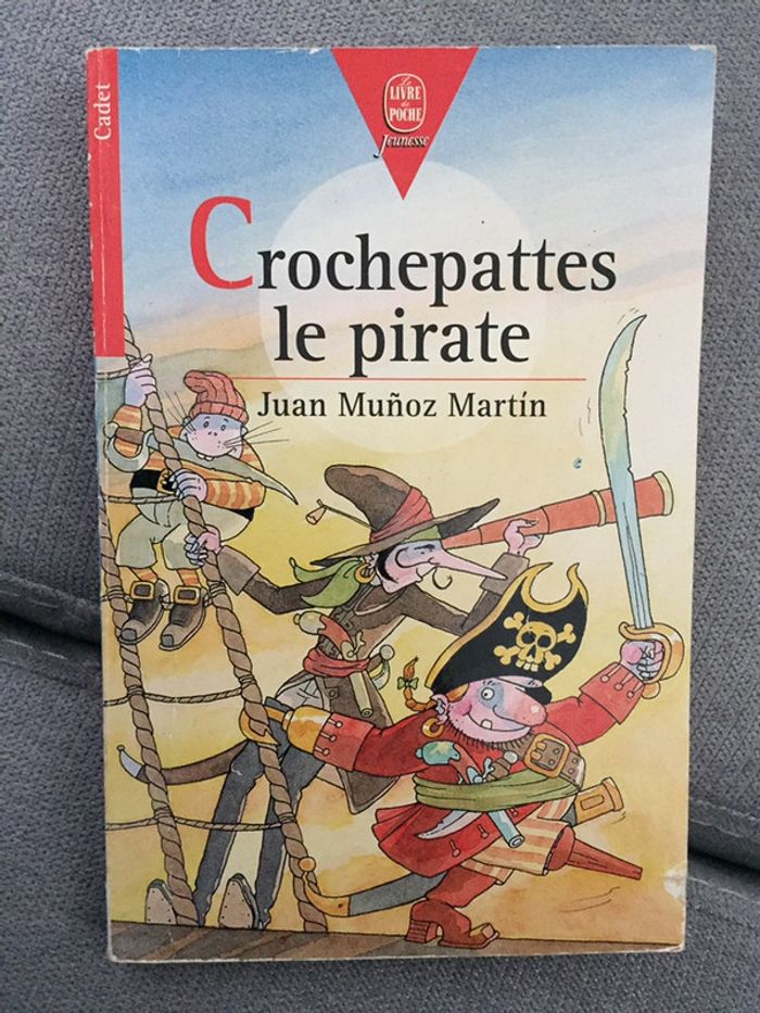 AA25-Livre: croche pattes le pirate NEUF
