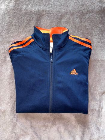 Veste de jogging Adidas taille 16 ans bleu et orange en très bon état