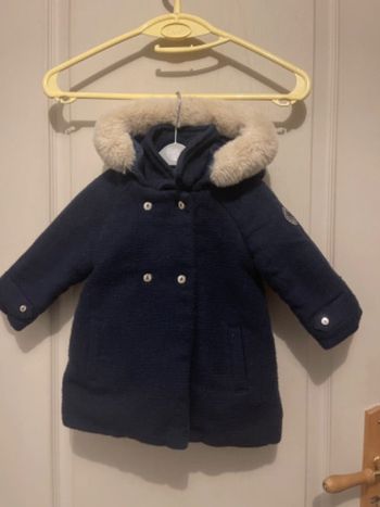 Manteau capuche à fourrure