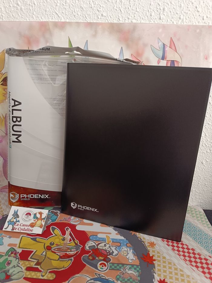 PHOENIX SHIELD - Album noir - 396 places - NEUF