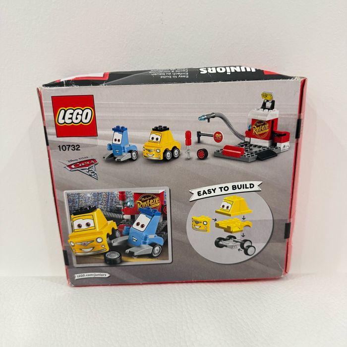 Lego Juniors 10732 - L'arrêt Au Stand De Guido Et Luigi - Boite neuve, scellée mais un peu abîmée (voir photos). - photo numéro 3