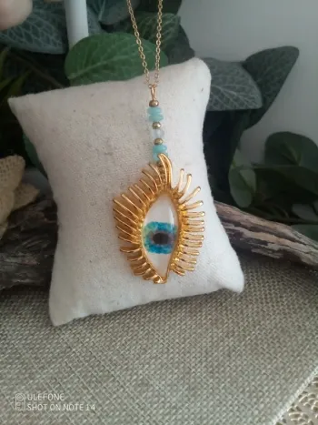 Collier oeil et pierres aigue marine