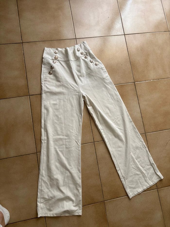 Pantalon large en bas avec fausse poche
