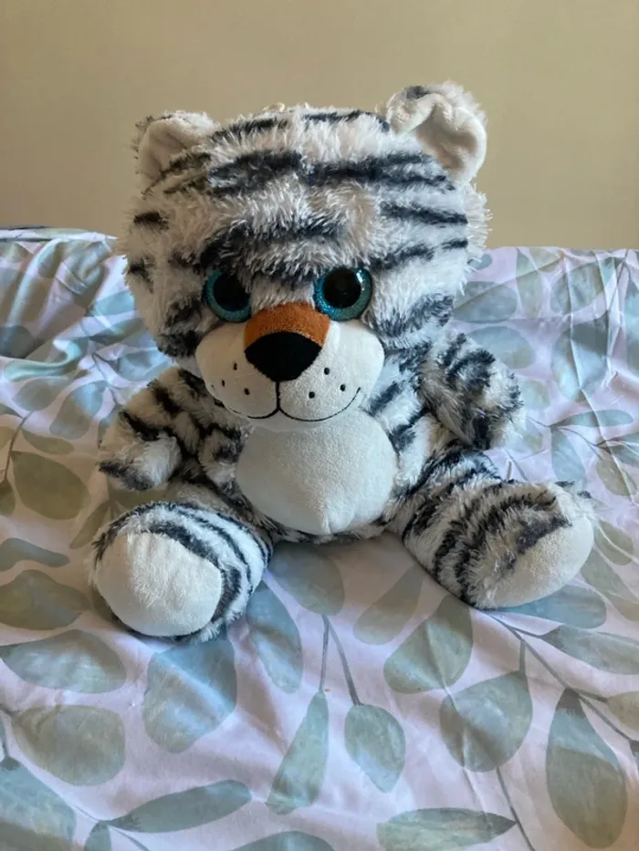 Peluche tigre avec les yeux pailletés