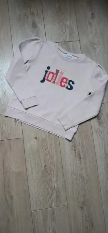 Pull type sweat "les filles heureuses sont les plus jolies" 10 ans état neuf