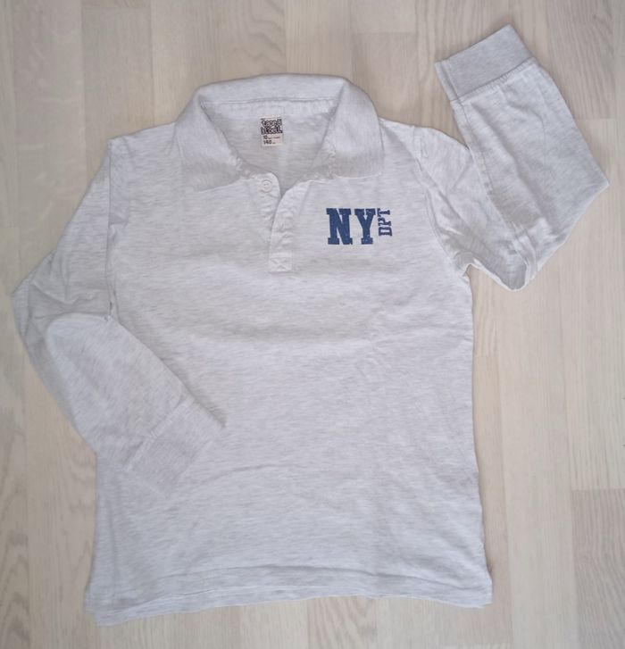 Polo gris chiné très clair Tape à l'oeil 
T. 10 ans