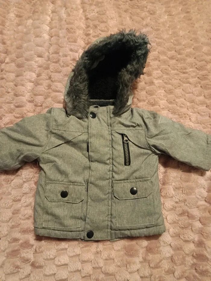 Manteau fourré Primark t 0/3m 62cm tbe