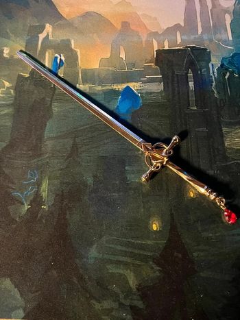 Bâton à chignon épée dorée