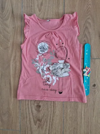 T-shirt sans manche 6 ans très bon état