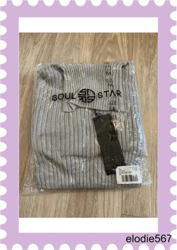 Pull col roulé