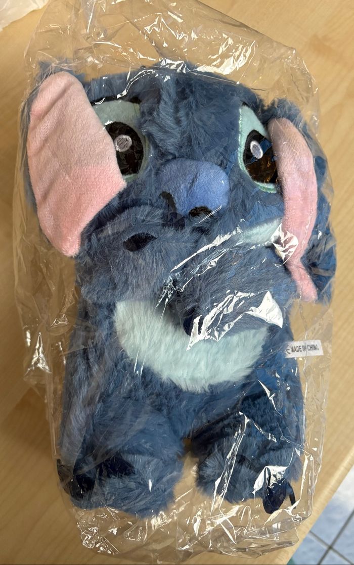 Peluche Stitch 28 cm lumineuse, respire,fait musique, les oreilles bougent 4 modes NEUF - photo numéro 4