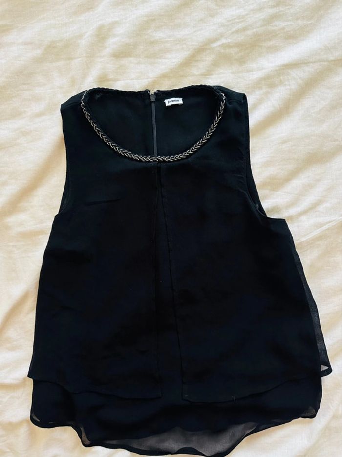 Blouse sans manches col collier