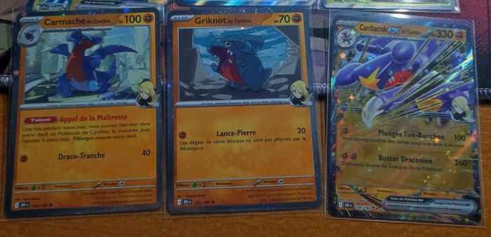 Lot cartes EV10 Rivalités destinées team rocket : carchacrok promo svp 204 + 2 cosmo promo + 2 full art eleka le 212 et oyacata 211 + 12 ex ( dont ho oh nidoking nostenfer persona et carchacrok etc ) Pokemon par Asmodée bloc écarlate et violet - photo numéro 3
