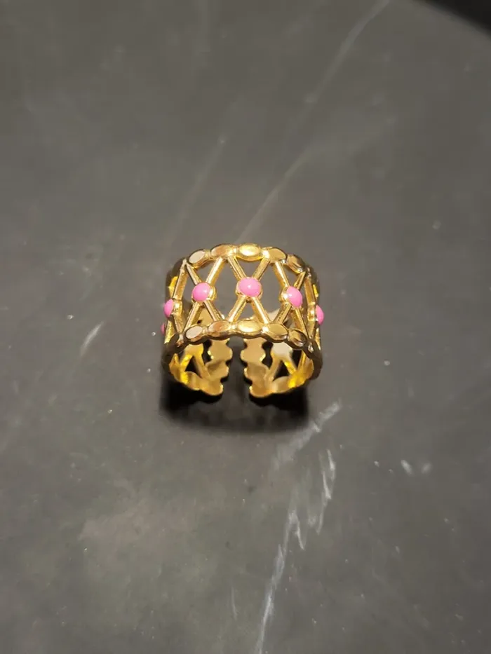 Bague acier inoxydable doré croisillons points roses