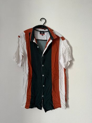 Chemise manche courte en très bon état taille M le brève