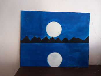 Toile peint  à main en très bon état.
"La lune sur le lac"