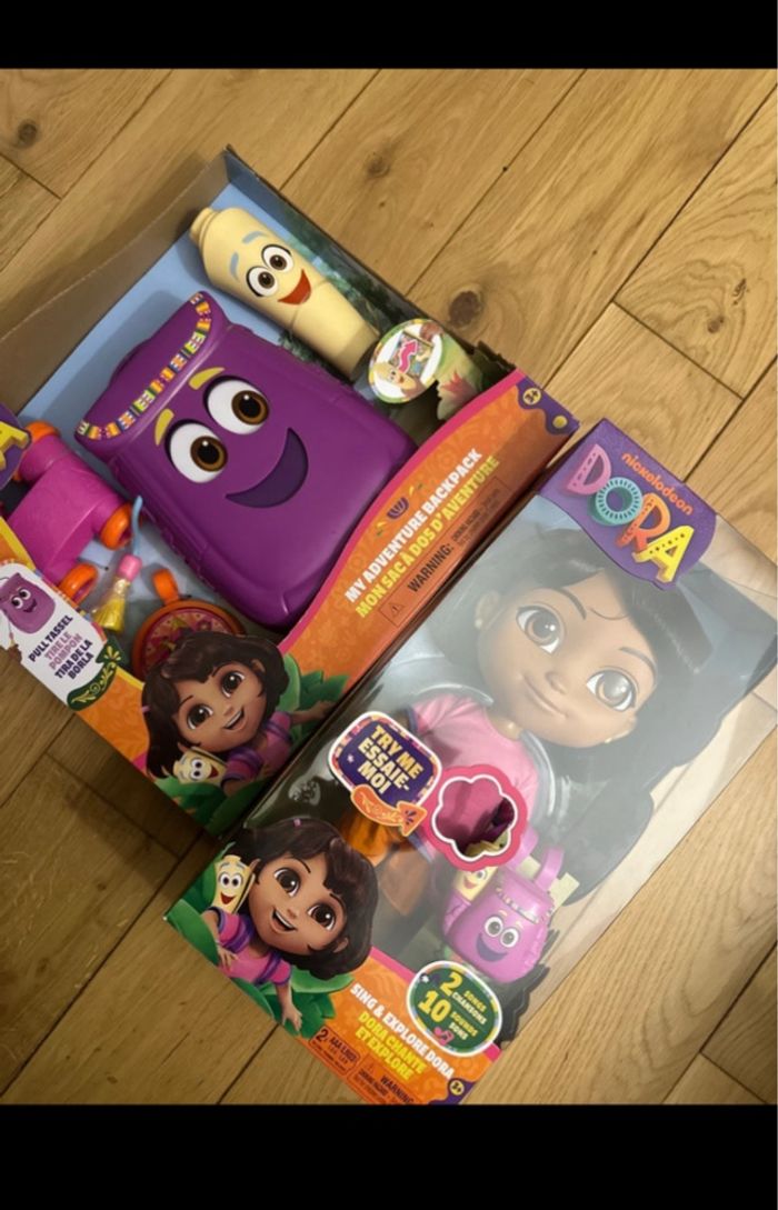 Lot poupée poupon dora + sac à dos