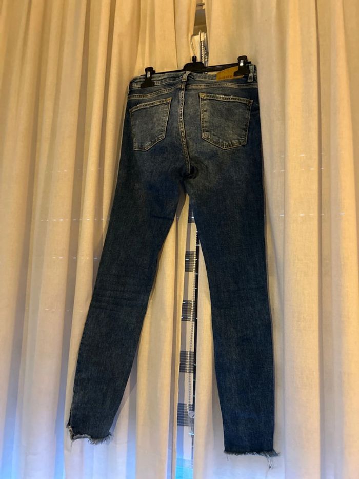Jeans trouée - photo numéro 6